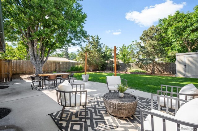 5167 S Pearl St, Littleton, CO 80121 - fenced backyard with outdoor dining space, a shed, and a patio
