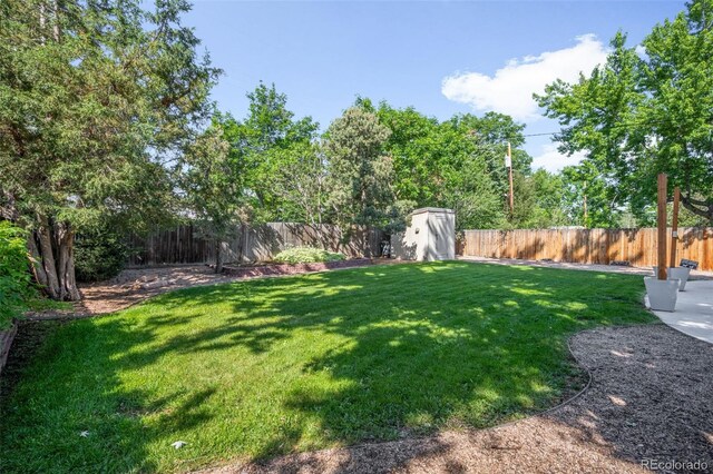 5167 S Pearl St, Littleton, CO 80121 - fenced backyard featuring a storage shed