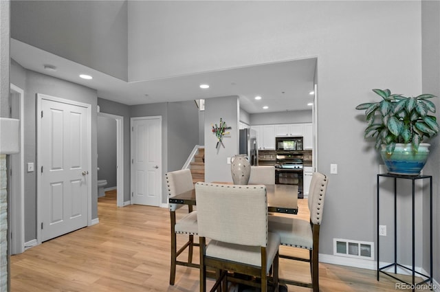 14300 Waterside Ln Unit E3, Broomfield, CO 80023 - dining space with stairs, light wood-type flooring, and recessed lighting