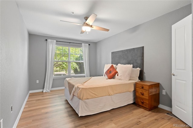 14300 Waterside Ln Unit E3, Broomfield, CO 80023 - bedroom with light wood-style flooring and a ceiling fan