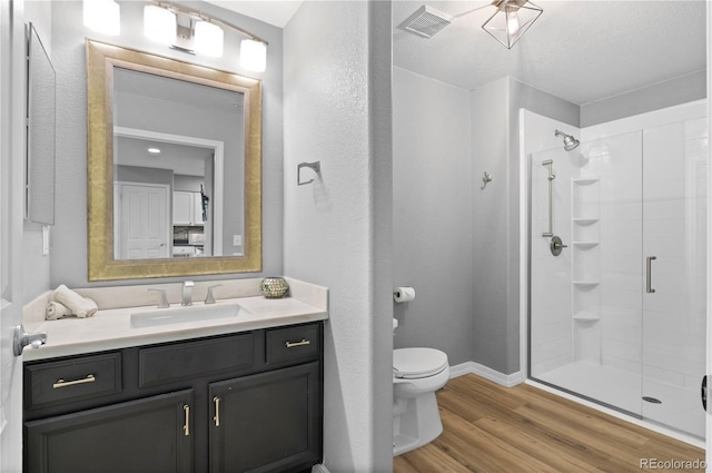 14300 Waterside Ln Unit E3, Broomfield, CO 80023 - full bath featuring a shower stall, wood finished floors, and vanity