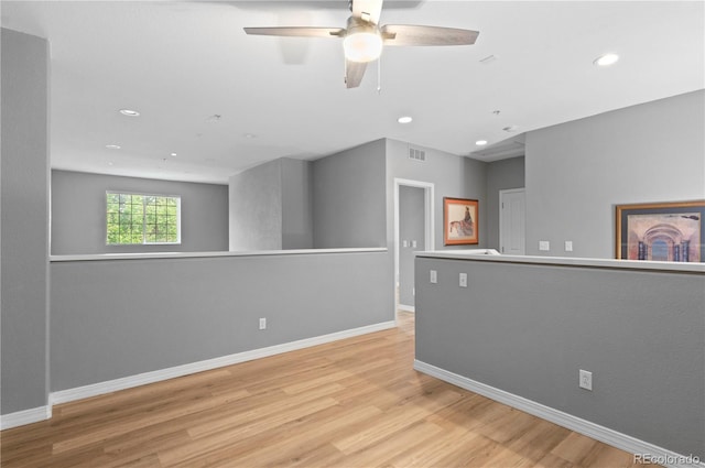 14300 Waterside Ln Unit E3, Broomfield, CO 80023 - spare room with wood finished floors, a ceiling fan, and recessed lighting