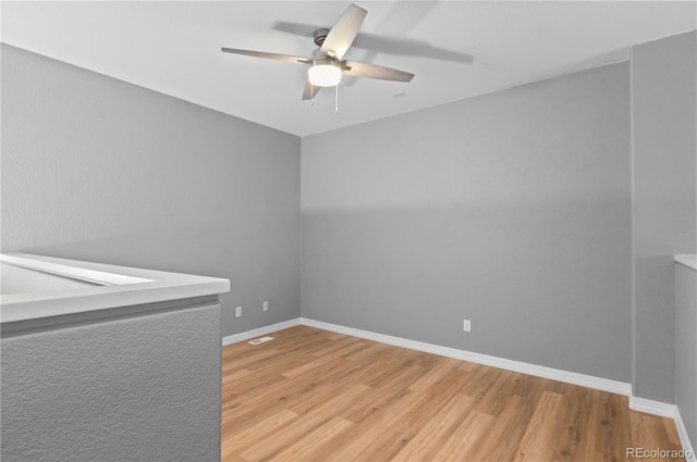 14300 Waterside Ln Unit E3, Broomfield, CO 80023 - spare room featuring wood finished floors and a ceiling fan