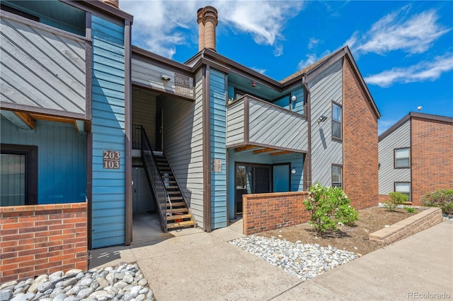 view of property featuring stairway