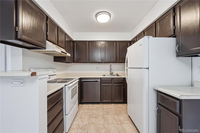 kitchen featuring a sink, dark brown cabinetry, under cabinet range hood, and white appliances