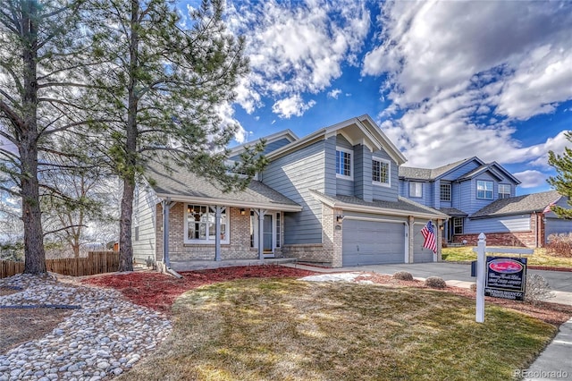 view of front of home featuring a garage, brick siding, fence, and driveway