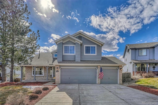 traditional home featuring a garage, driveway, brick siding, and a shingled roof