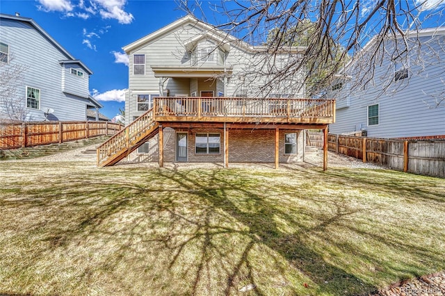 back of property featuring a fenced backyard, stairway, and a wooden deck