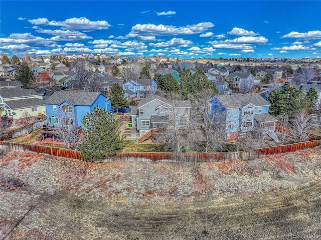 birds eye view of property with a residential view