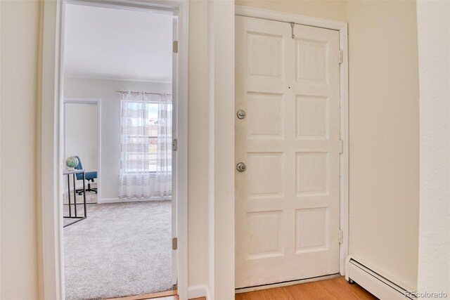 doorway featuring light hardwood / wood-style flooring and a baseboard radiator