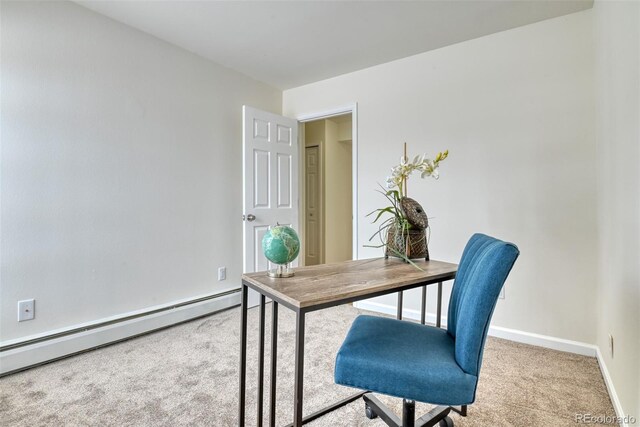 office space featuring baseboard heating and light carpet