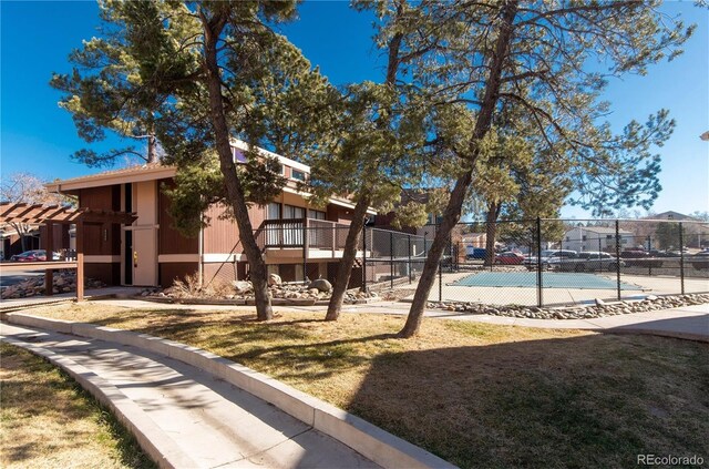 exterior space featuring tennis court