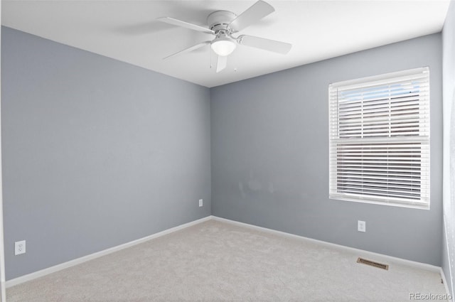 carpeted empty room with ceiling fan