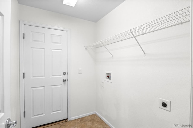 laundry area with washer hookup, hookup for an electric dryer, and light tile patterned floors