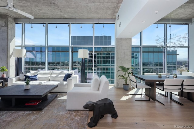 1700 Bassett St Unit 2315, Denver, CO 80202 - living room with expansive windows, wood finished floors, and a chandelier