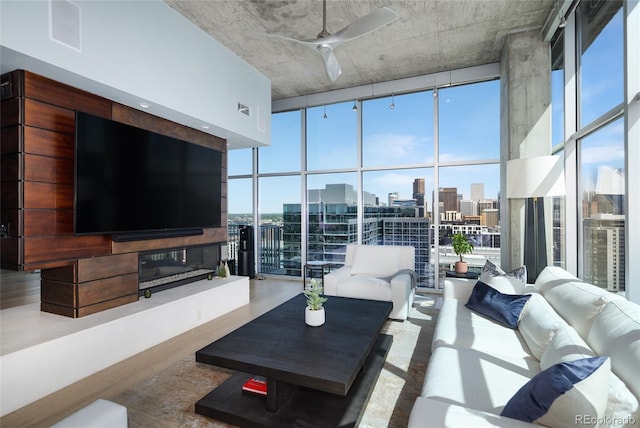 1700 Bassett St Unit 2315, Denver, CO 80202 - living room featuring expansive windows, a ceiling fan, and wood finished floors