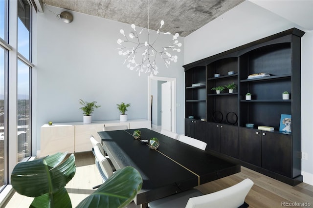 1700 Bassett St Unit 2315, Denver, CO 80202 - dining room featuring light wood-style floors and a chandelier