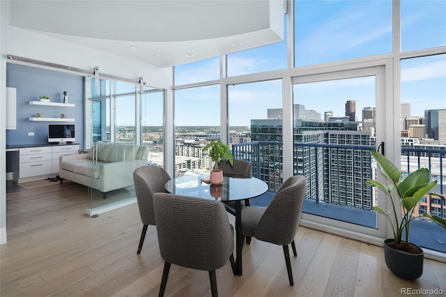 1700 Bassett St Unit 2315, Denver, CO 80202 - dining room featuring floor to ceiling windows, light wood finished floors, and a view of city