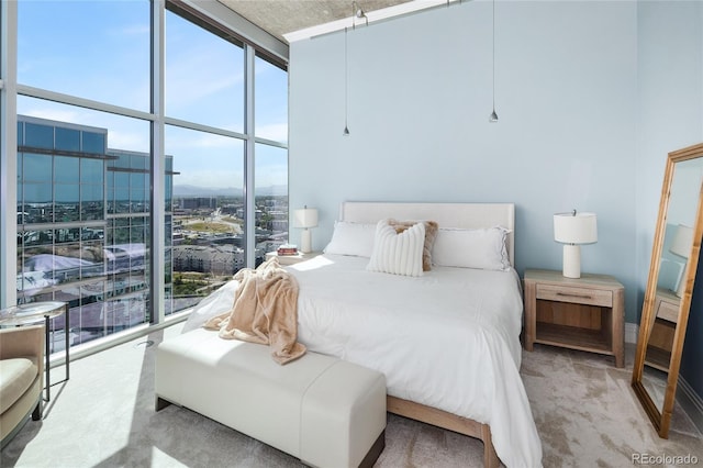 1700 Bassett St Unit 2315, Denver, CO 80202 - bedroom with floor to ceiling windows and carpet flooring