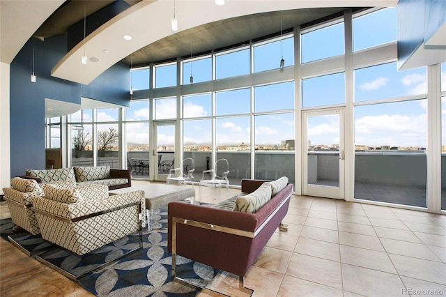 1700 Bassett St Unit 2315, Denver, CO 80202 - tiled living area with a towering ceiling and a wall of windows
