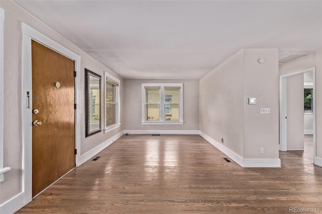 4654 Bryant St, Denver, CO 80211 - empty room with wood finished floors and healthy amount of natural light