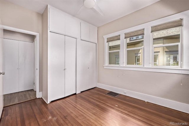 4654 Bryant St, Denver, CO 80211 - unfurnished bedroom with dark wood-style flooring and a ceiling fan