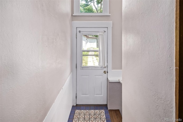 4654 Bryant St, Denver, CO 80211 - doorway with a textured wall and tile patterned flooring