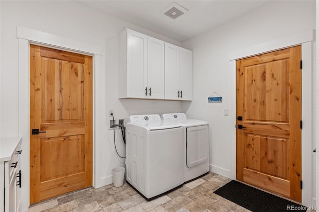 740 W County Road 10e, Berthoud, CO 80513 - laundry room with baseboards, stone finish floor, cabinet space, and washer and clothes dryer
