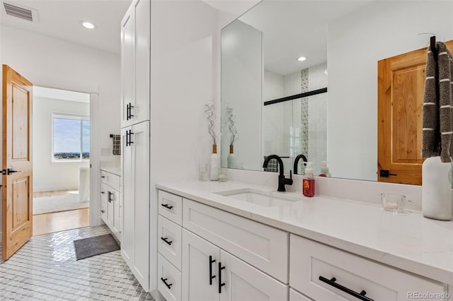 740 W County Road 10e, Berthoud, CO 80513 - full bath featuring visible vents, a stall shower, vanity, tile patterned floors, and recessed lighting