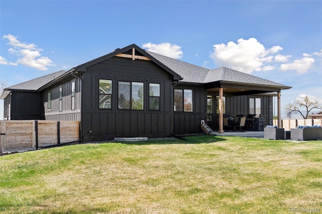 740 W County Road 10e, Berthoud, CO 80513 - back of house featuring a patio, board and batten siding, fence, and a yard