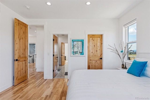 740 W County Road 10e, Berthoud, CO 80513 - bedroom featuring light wood-style floors, baseboards, and recessed lighting