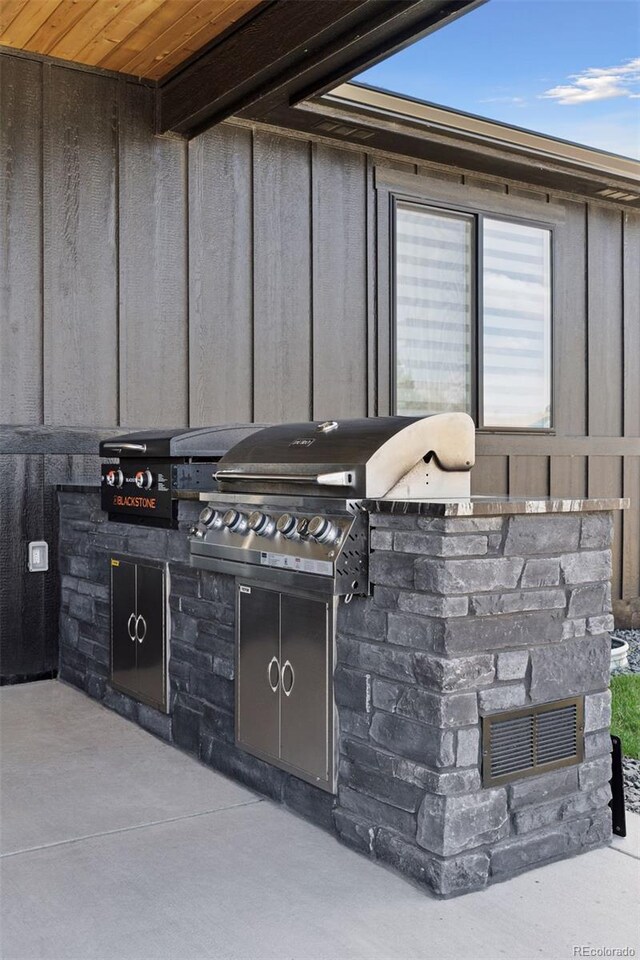 740 W County Road 10e, Berthoud, CO 80513 - view of patio / terrace featuring an outdoor kitchen, a grill, and visible vents