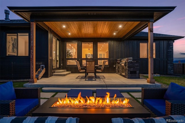 740 W County Road 10e, Berthoud, CO 80513 - view of patio / terrace featuring an outdoor living space with a fire pit and exterior kitchen