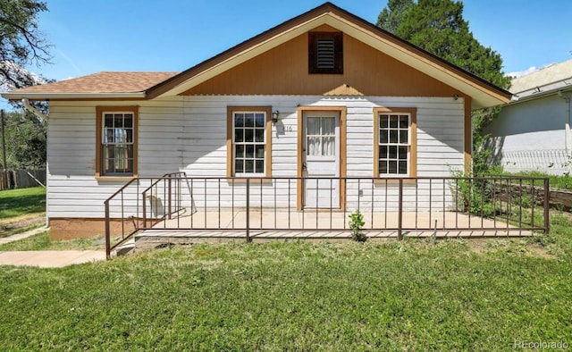 view of front of home with a front yard