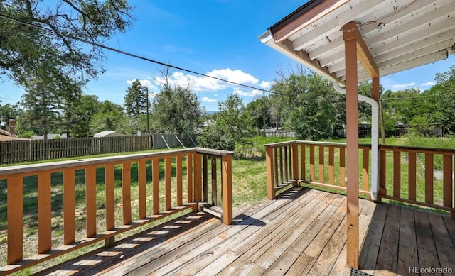 wooden deck with a yard