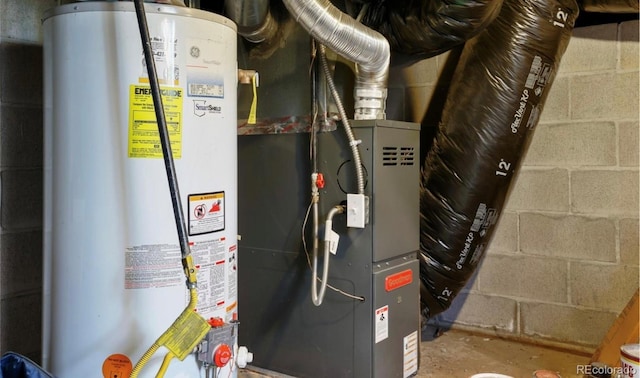 utility room featuring water heater