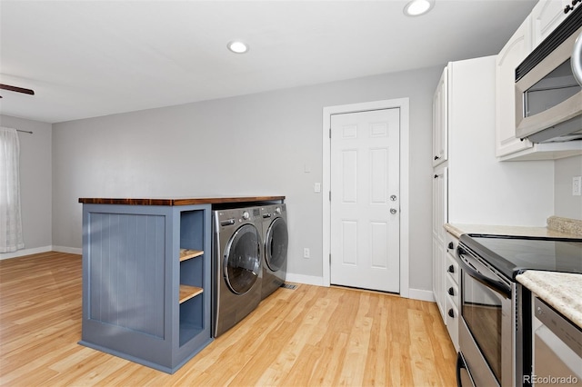 washroom with ceiling fan, washing machine and dryer, light wood-style flooring, recessed lighting, and baseboards