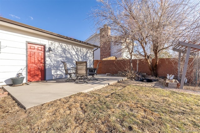 view of yard featuring a patio area and a fenced backyard