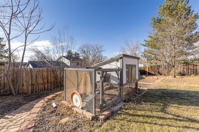 view of poultry coop featuring a lawn and fence private yard