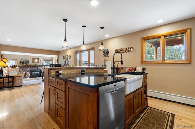 kitchen featuring light hardwood / wood-style flooring, dishwasher, a baseboard heating unit, and pendant lighting