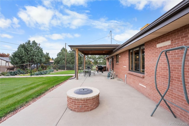 view of patio featuring an outdoor fire pit