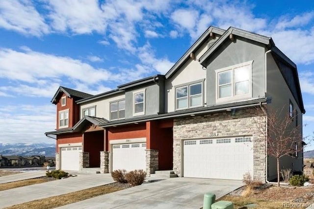 13316 Positano Pt, Colorado Springs, CO 80921 - view of front of home with an attached garage, stone siding, and stucco siding