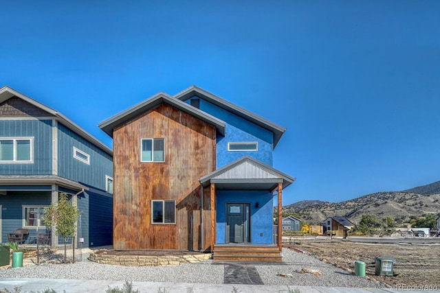 view of front of home featuring a mountain view