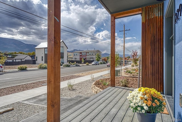 deck with a mountain view and a porch