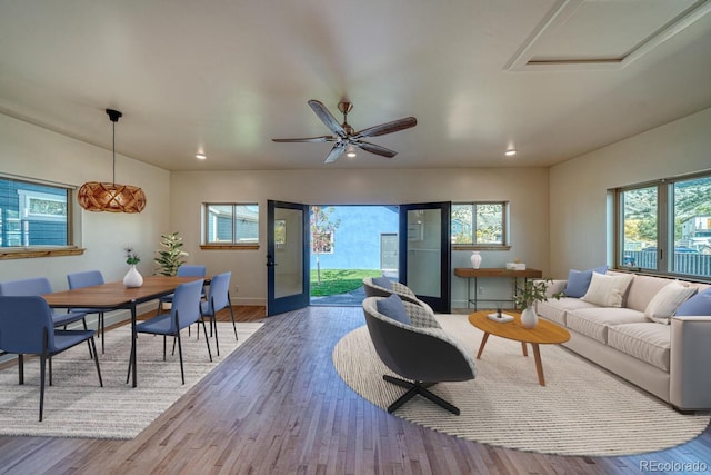 living room with french doors, hardwood / wood-style flooring, plenty of natural light, and ceiling fan