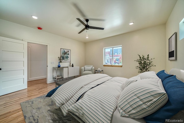 bedroom featuring light wood-type flooring and ceiling fan