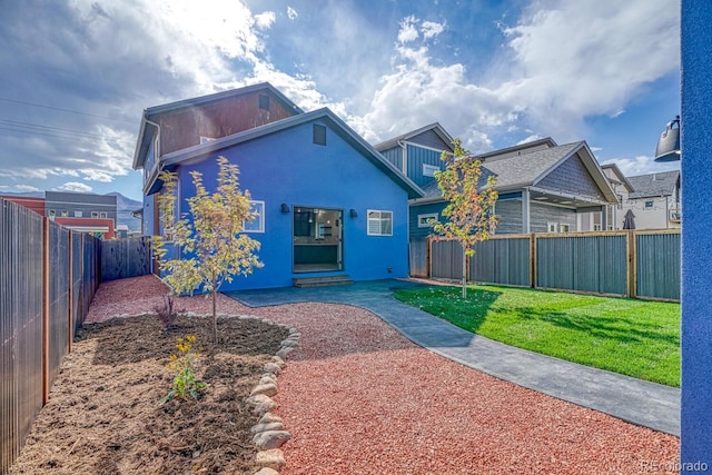 view of front of home with a front lawn