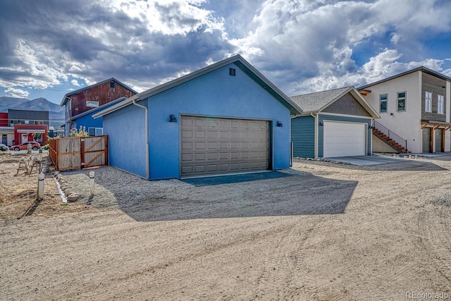 view of front of house featuring a mountain view and a garage