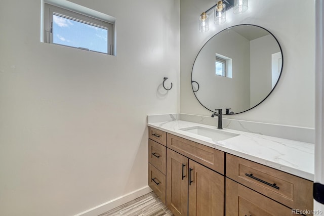 bathroom featuring hardwood / wood-style floors and vanity