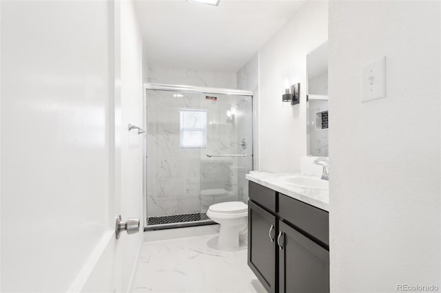 bathroom with toilet, marble finish floor, a stall shower, and vanity